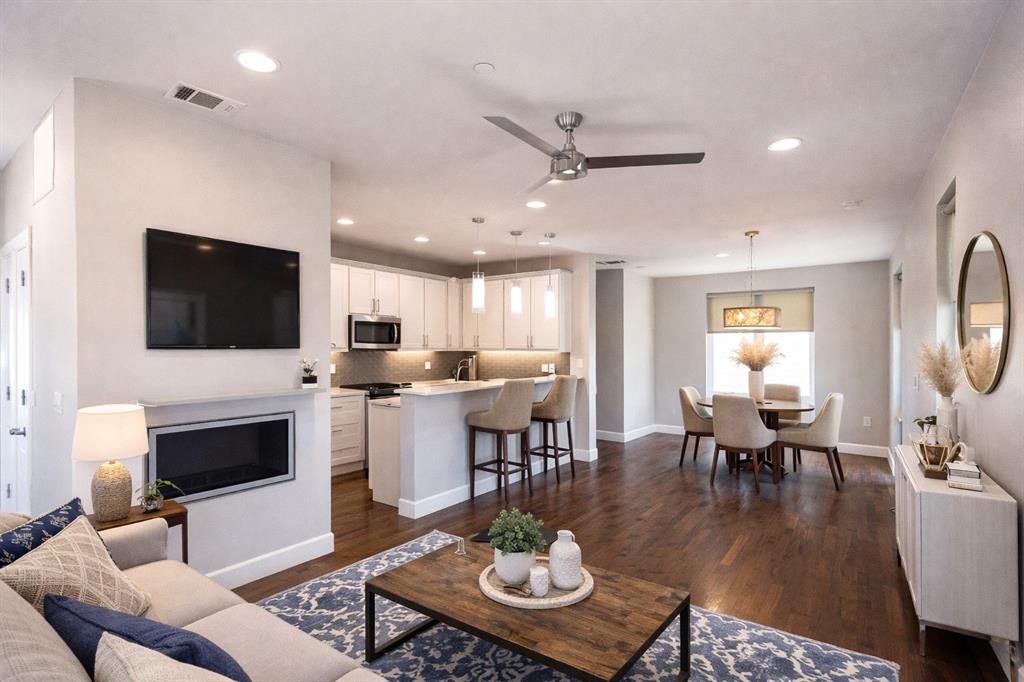 2016 North Fitzhugh Avenue, Unit 101 Dallas, TX 75204 - Photo 3 of 27 a living room with fireplace furniture and a flat screen tv