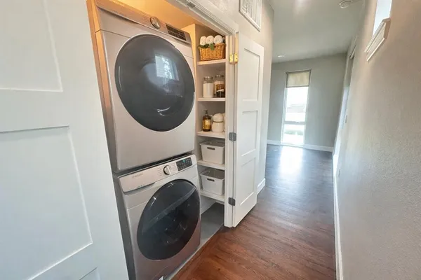 a view of a hallway with washer and dryer