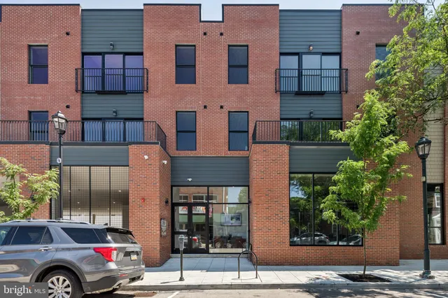 a front view of a building with garden