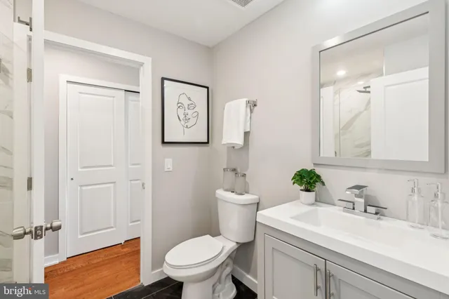 a bathroom with a sink toilet and vanity