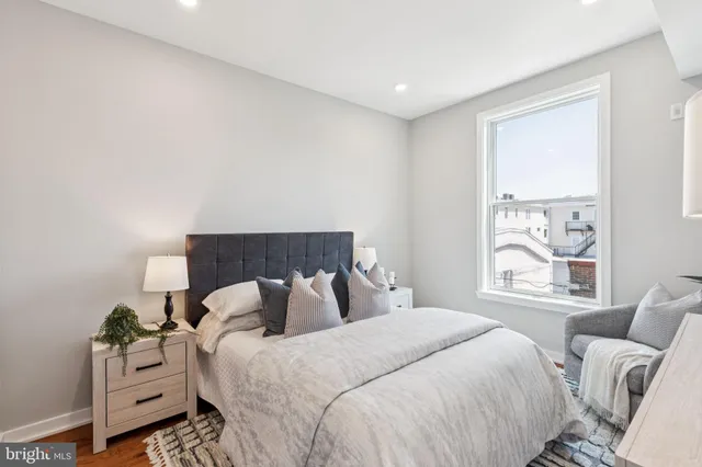 a bedroom with bed and a window