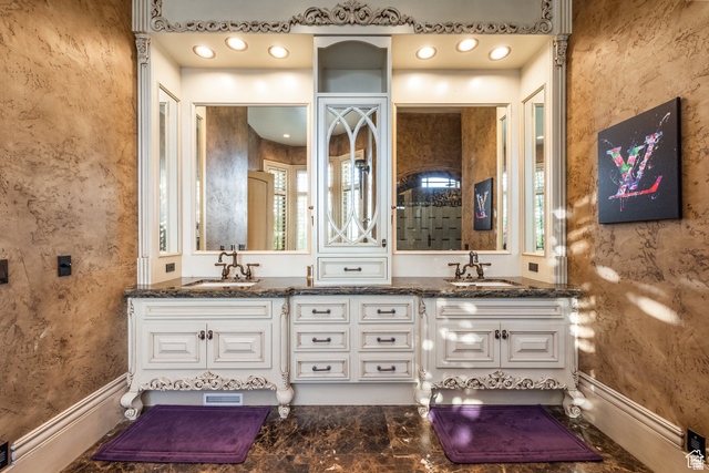 694 West Cephus Road Draper, UT 84020 - Photo 47 of 148 Dual sink vanity with intricate carved detailing, granite countertops, and individual mirrors