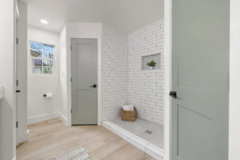 a bed room with a bed and a chair