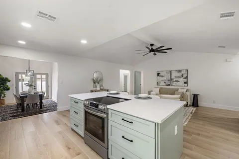 a view of a house with a backyard