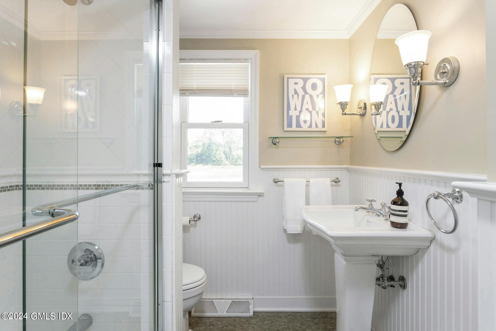 61 Roton Avenue Norwalk, CT 06853 - Photo 13 of 31 a bathroom with a sink mirror and toilet