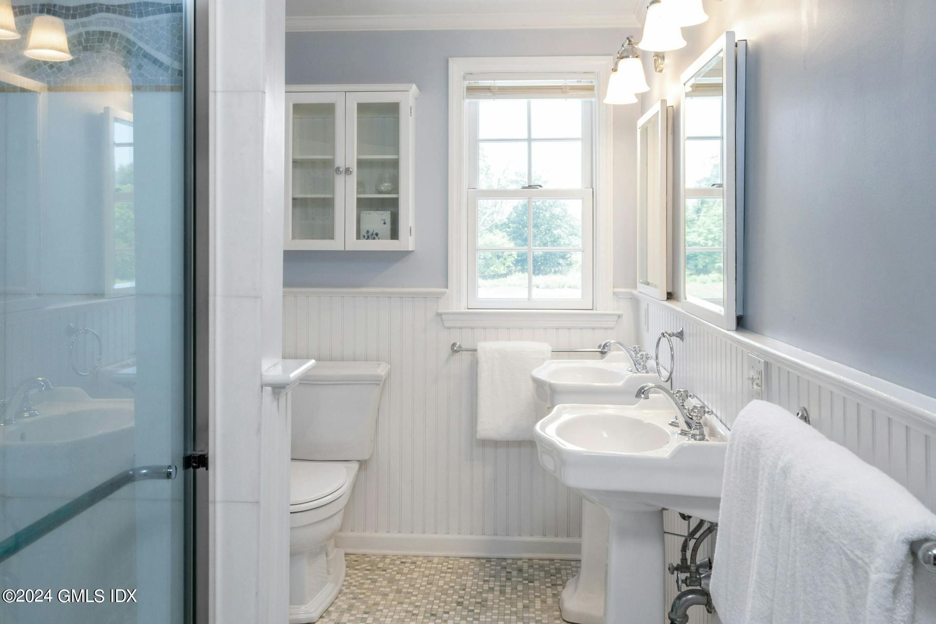 61 Roton Avenue Norwalk, CT 06853 - Photo 14 of 31 a bathroom with a sink toilet and shower