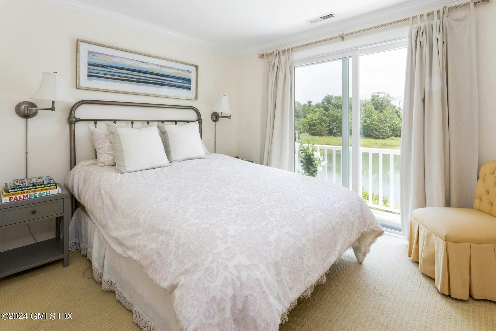 61 Roton Avenue Norwalk, CT 06853 - Photo 15 of 31 a bedroom with a bed and a large window