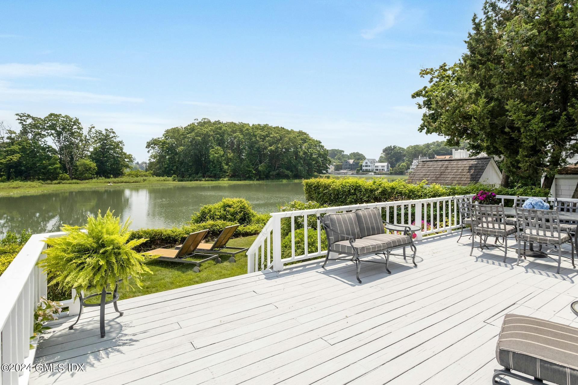61 Roton Avenue Norwalk, CT 06853 - Photo 18 of 31 a view of a deck with chair and wooden floor