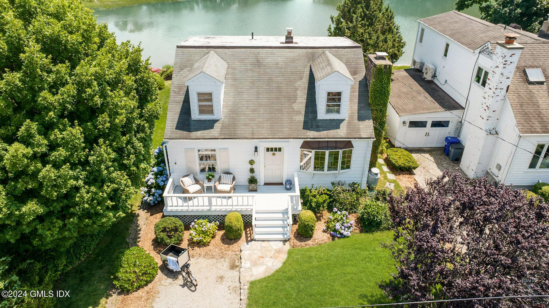61 Roton Avenue Norwalk, CT 06853 - Photo 2 of 31 a aerial view of a house with swimming pool and garden