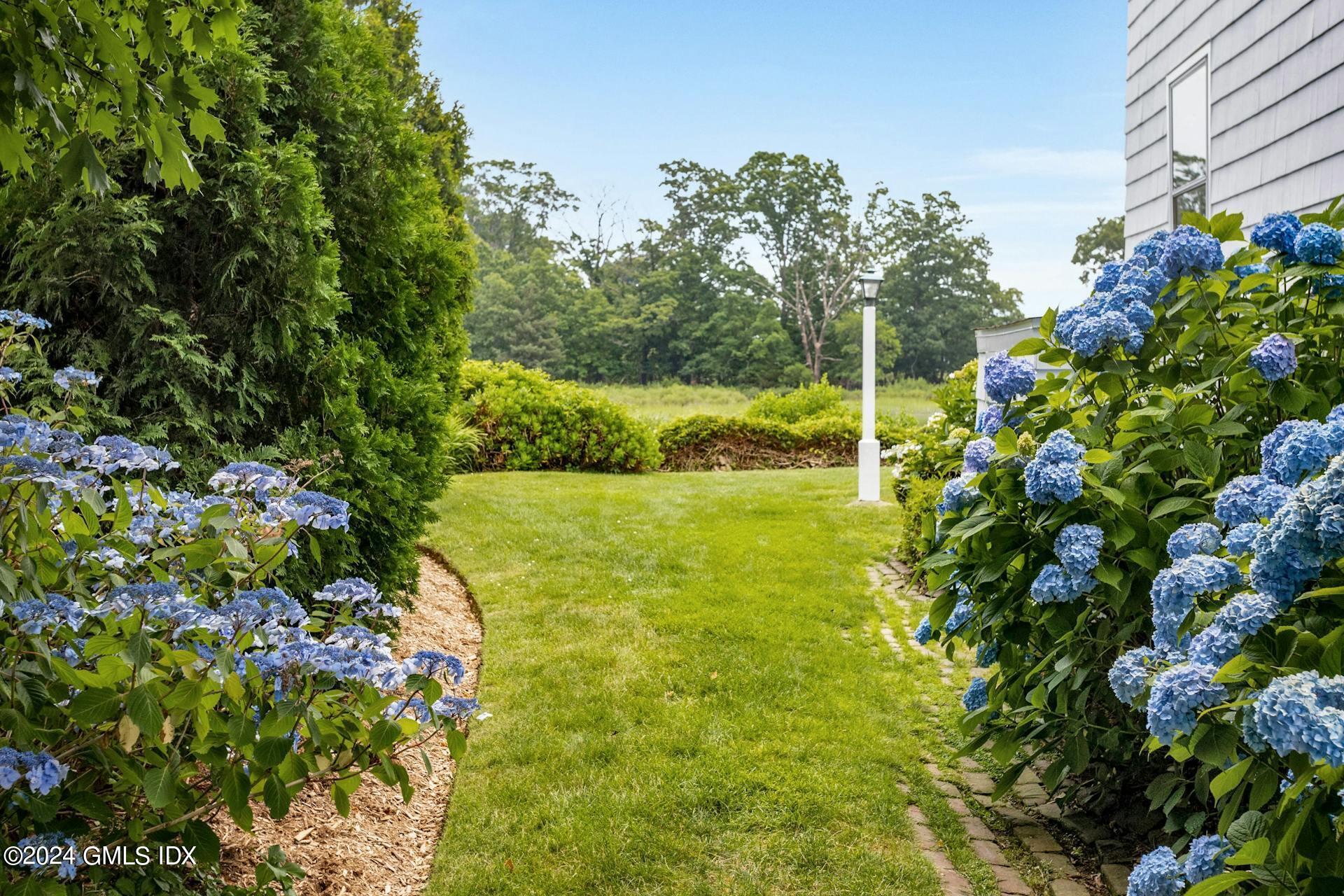 61 Roton Avenue Norwalk, CT 06853 - Photo 21 of 31 a view of yard with swimming pool