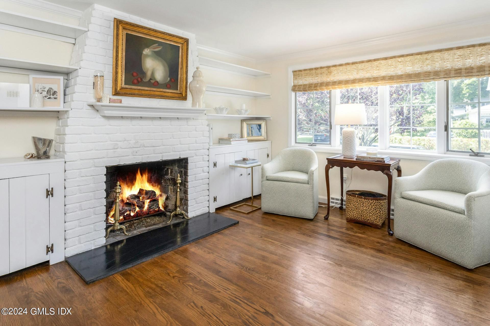 61 Roton Avenue Norwalk, CT 06853 - Photo 7 of 31 a living room with furniture and a fireplace