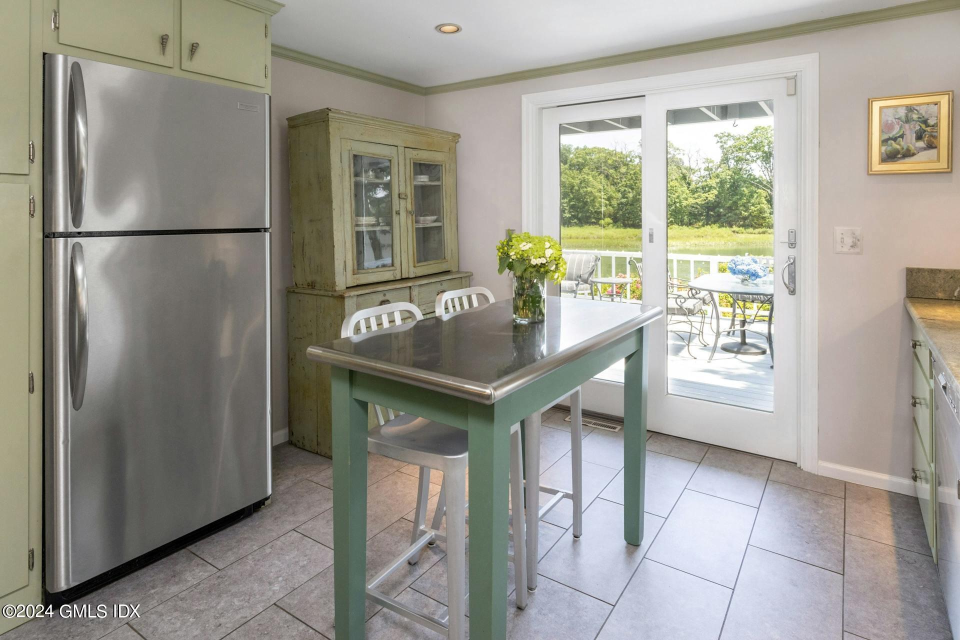 61 Roton Avenue Norwalk, CT 06853 - Photo 10 of 31 a kitchen with stainless steel appliances granite countertop a refrigerator and a sink