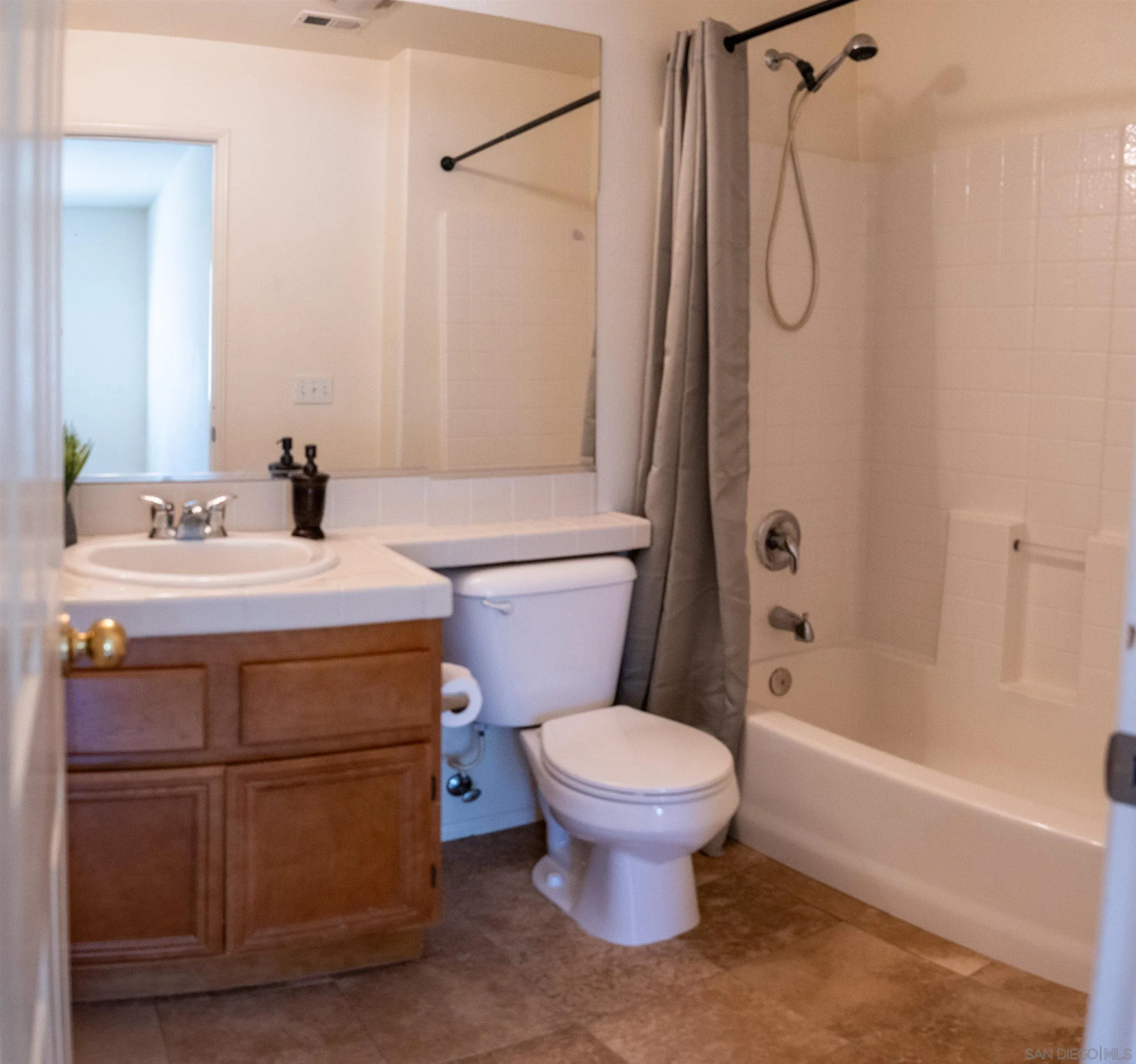 1246 Stagecoach Trail Loop Chula Vista, CA 91915 - Photo 12 of 17 a bathroom with a sink toilet and shower