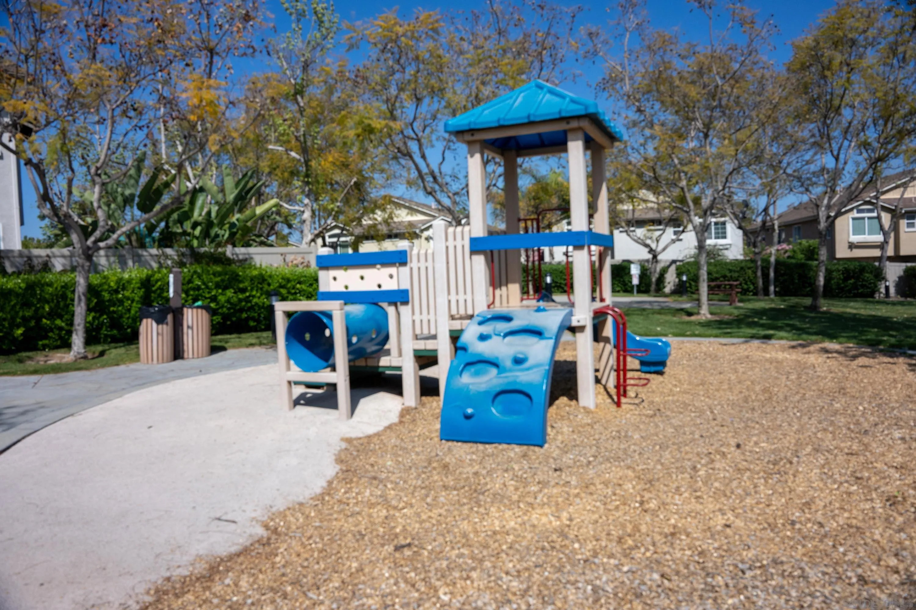 1246 Stagecoach Trail Loop Chula Vista, CA 91915 - Photo 17 of 17 a view of a chairs and tables in the patio and a fountain