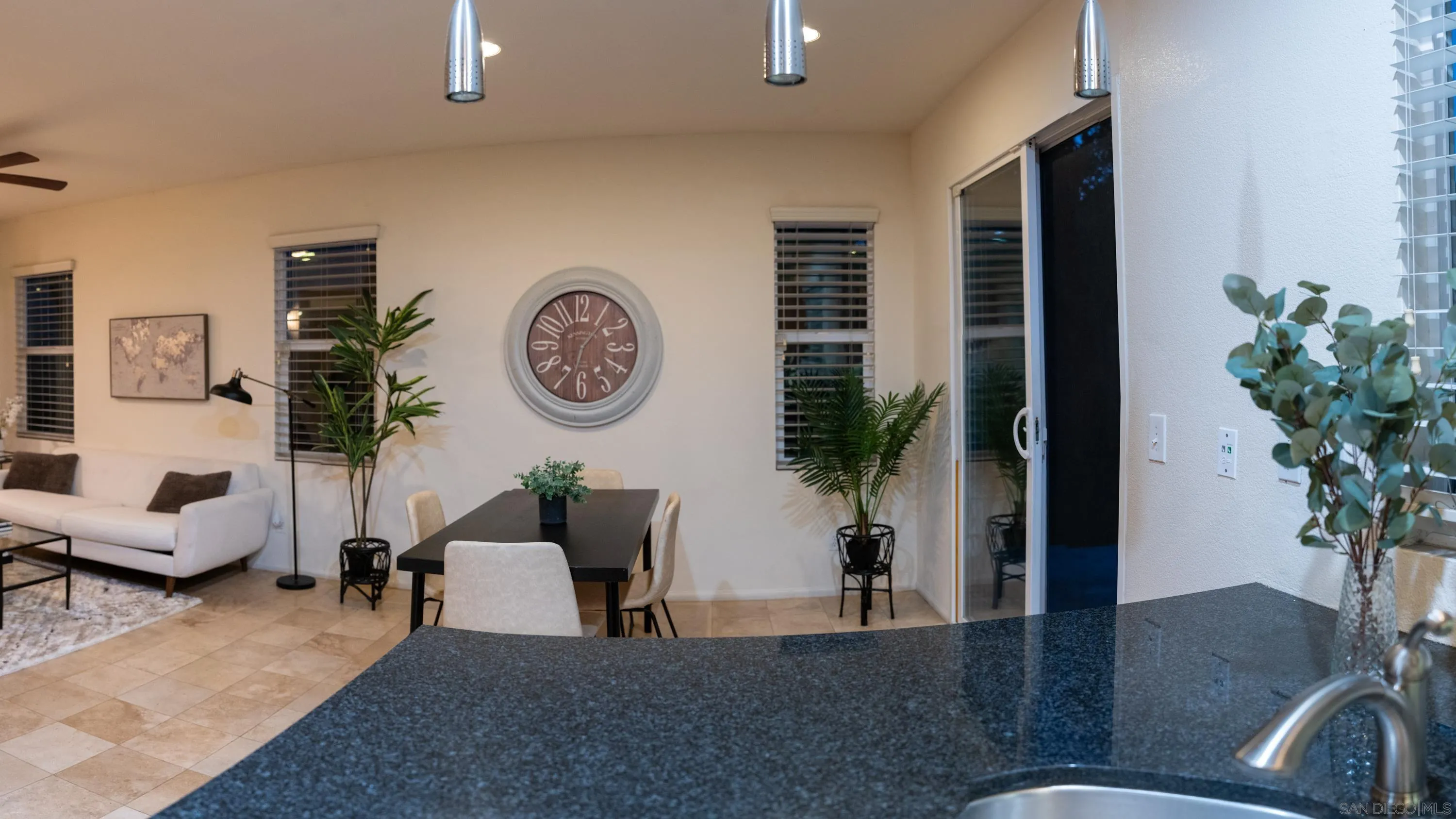 1246 Stagecoach Trail Loop Chula Vista, CA 91915 - Photo 5 of 17 a living room with furniture potted plant and a window