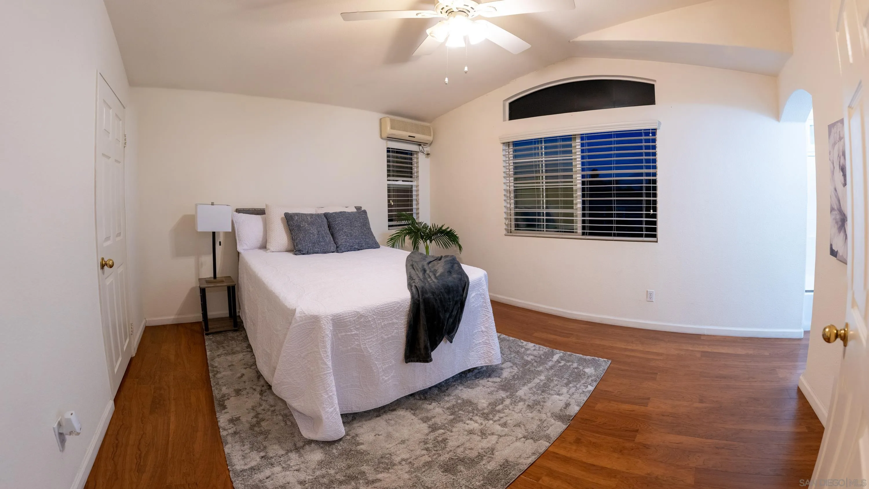 1246 Stagecoach Trail Loop Chula Vista, CA 91915 - Photo 8 of 17 a white bed sitting in a room next to a window