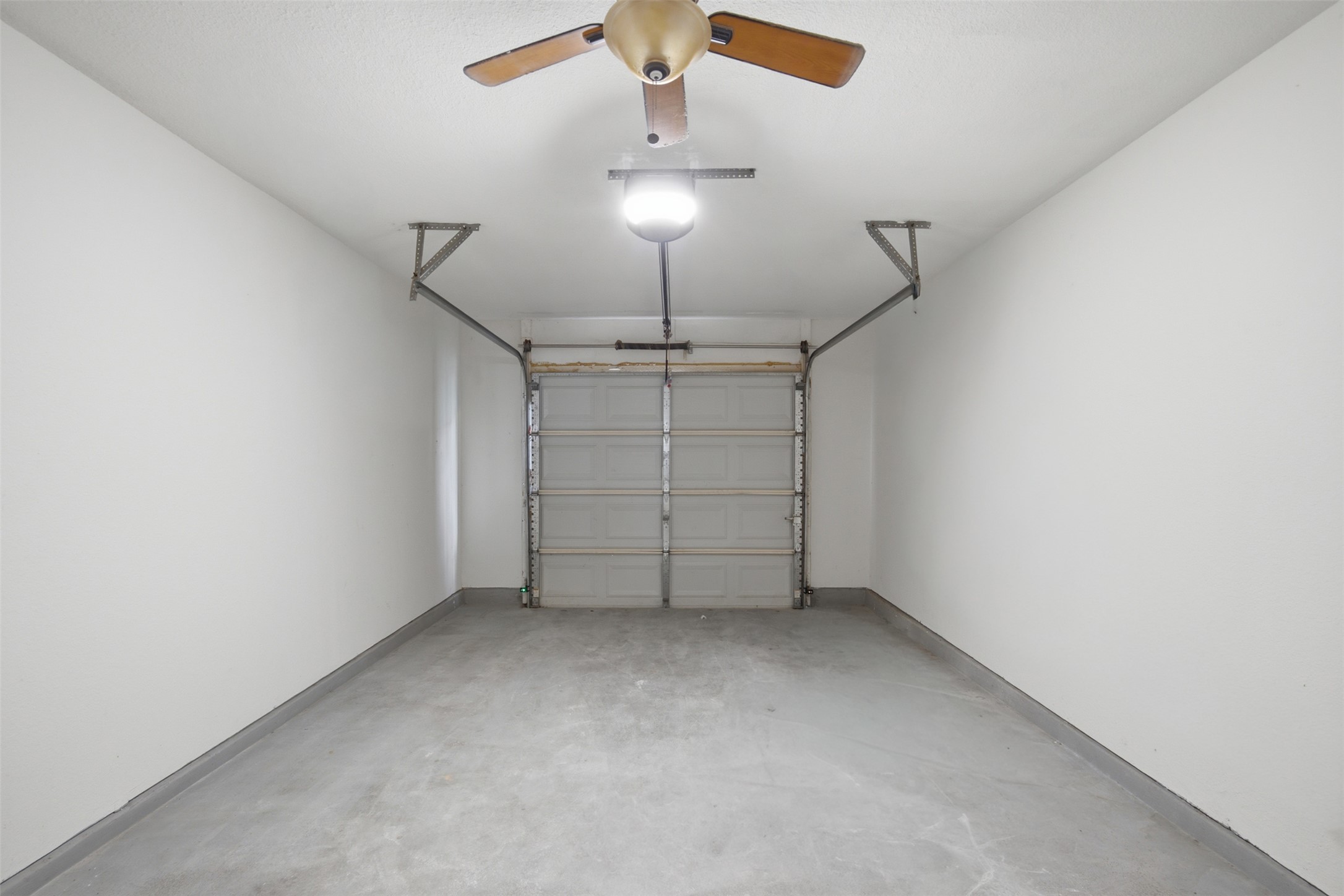 11611 Rustic Rock Drive, Unit B Austin, TX 78750 - Photo 24 of 30 A single-car garage with garage door opener