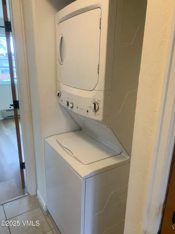 a view of a room with wooden floor and windows