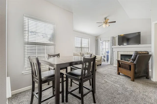 a view of a livingroom with furniture and a flat screen tv