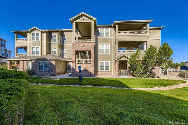 a view of a dining room with furniture and window