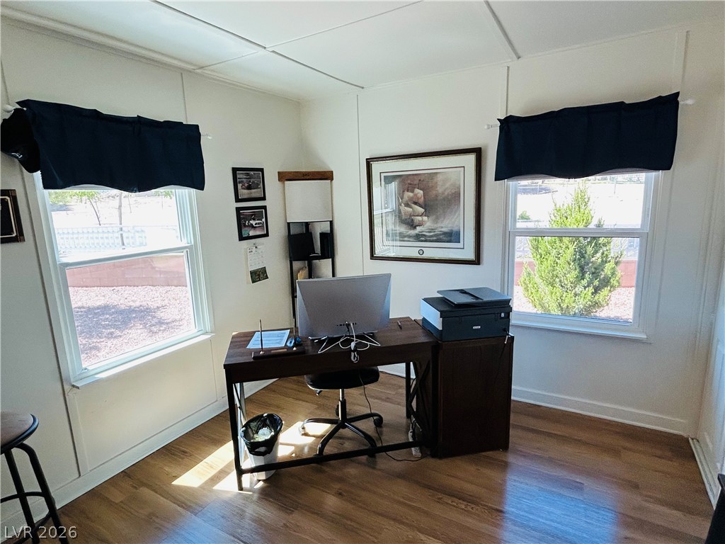 116 West Basic Road Henderson, NV 89015 - Photo 12 of 39 A well-lit home office features rich hardwood flooring and generous windows.