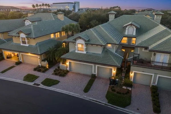 an aerial view of houses with yard