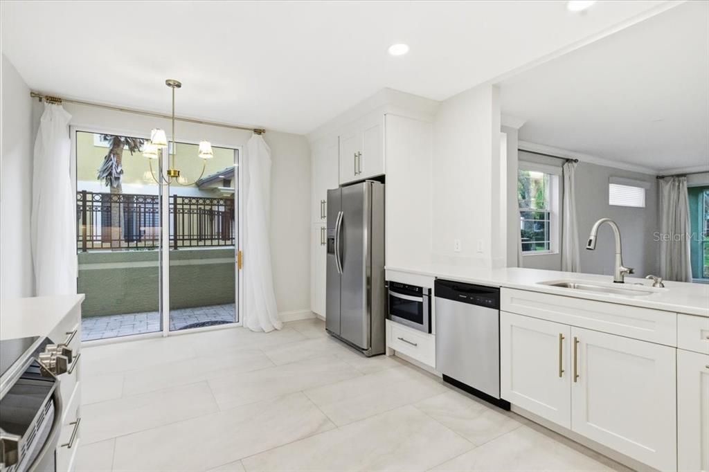 6536 Moorings Point Circle, Unit 101 Lakewood Ranch, FL 34202 - Photo 20 of 48 a spacious bathroom with a shower sink and mirror