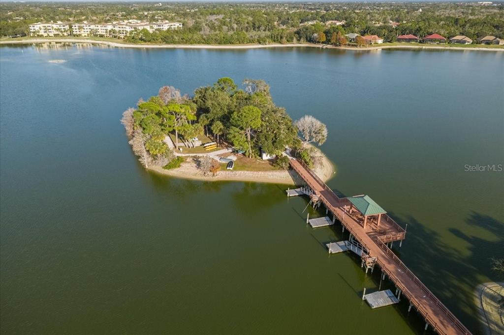 6536 Moorings Point Circle, Unit 101 Lakewood Ranch, FL 34202 - Photo 2 of 48 a view of a lake from a balcony