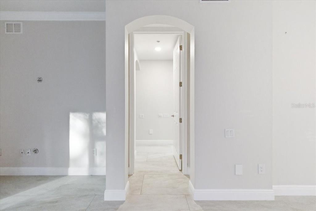 6536 Moorings Point Circle, Unit 101 Lakewood Ranch, FL 34202 - Photo 23 of 48 an empty room with mirror in it