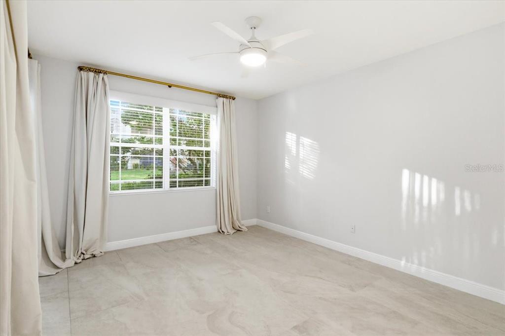 6536 Moorings Point Circle, Unit 101 Lakewood Ranch, FL 34202 - Photo 25 of 48 an empty room with windows and closet