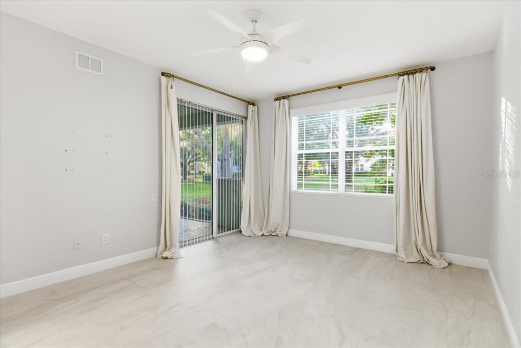 6536 Moorings Point Circle, Unit 101 Lakewood Ranch, FL 34202 - Photo 26 of 48 an empty room with windows and closet