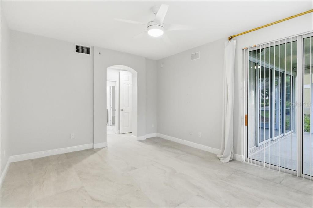 6536 Moorings Point Circle, Unit 101 Lakewood Ranch, FL 34202 - Photo 27 of 48 an empty room with windows and closet