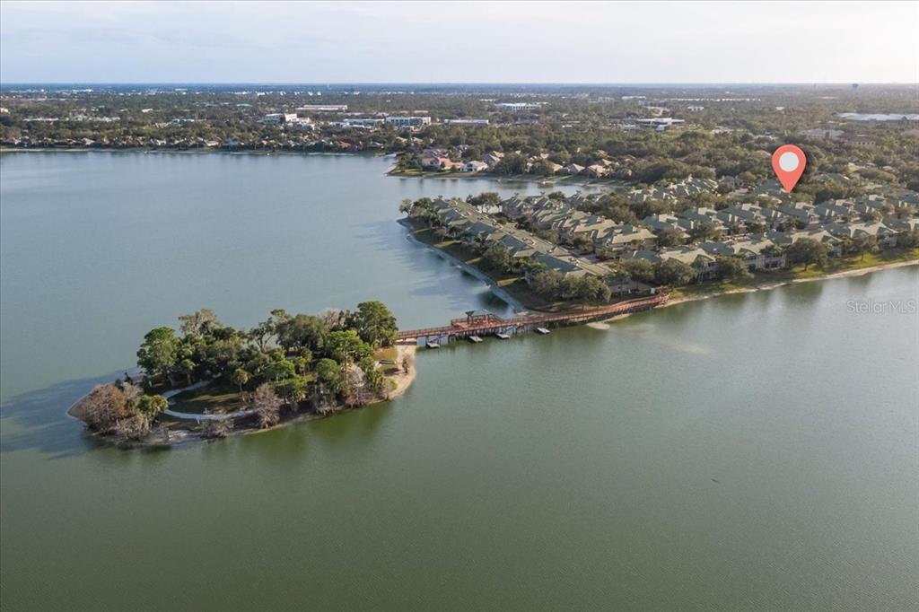 6536 Moorings Point Circle, Unit 101 Lakewood Ranch, FL 34202 - Photo 3 of 48 an aerial view of city and lake with boats