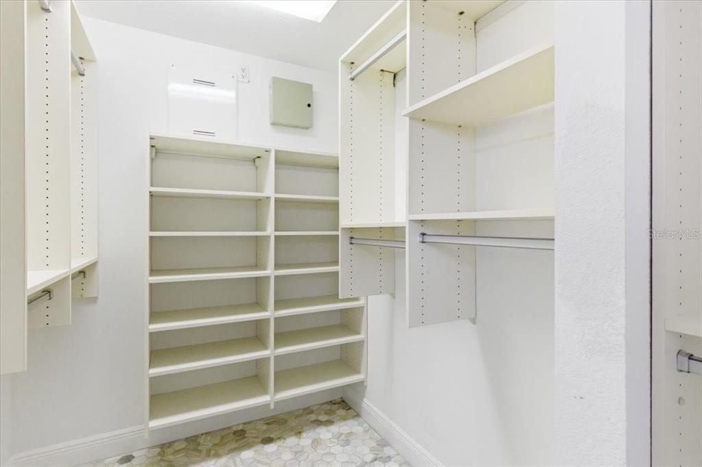 6536 Moorings Point Circle, Unit 101 Lakewood Ranch, FL 34202 - Photo 31 of 48 a view of walk in closet with empty racks