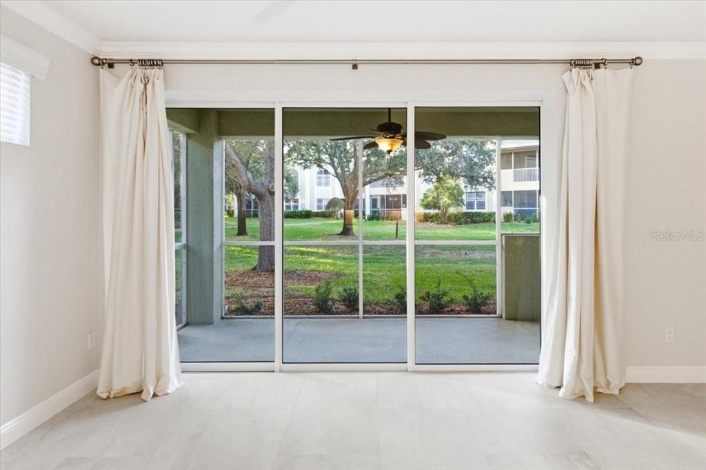 6536 Moorings Point Circle, Unit 101 Lakewood Ranch, FL 34202 - Photo 9 of 48 a view of backyard with green space