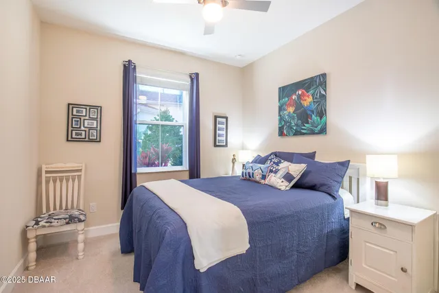 a view of a patio with table and chairs potted plants