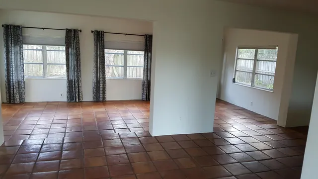 a view of an empty room with a window