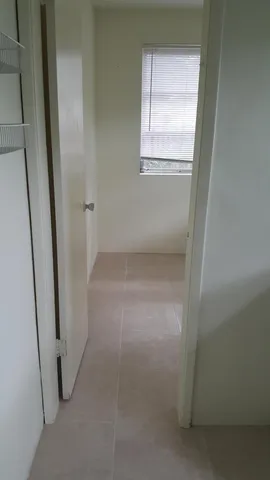 a view of empty room with windows