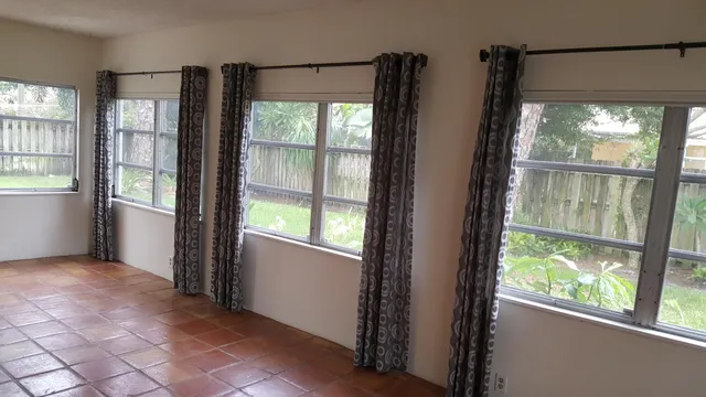 a view of an empty room and window