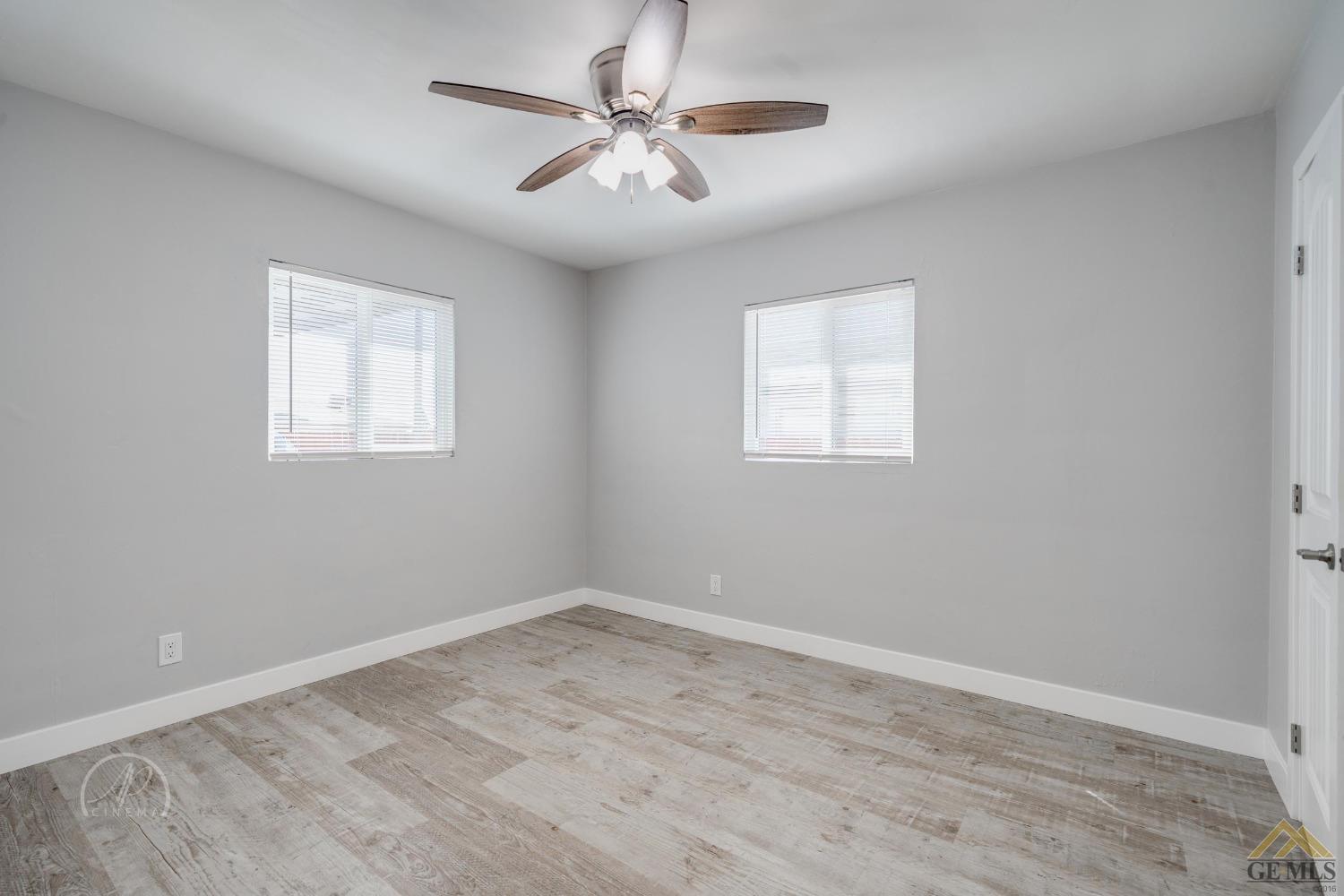 Undisclosed Address Bakersfield, CA 93305 - Photo 15 of 28 wooden floor in an empty room with a window