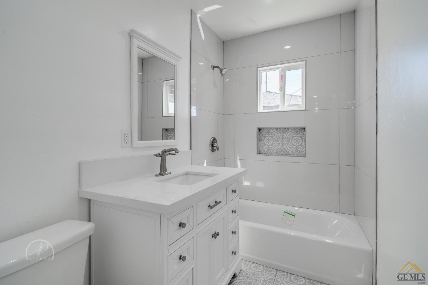 Undisclosed Address Bakersfield, CA 93305 - Photo 18 of 28 a bathroom with a sink toilet vanity tub and shower