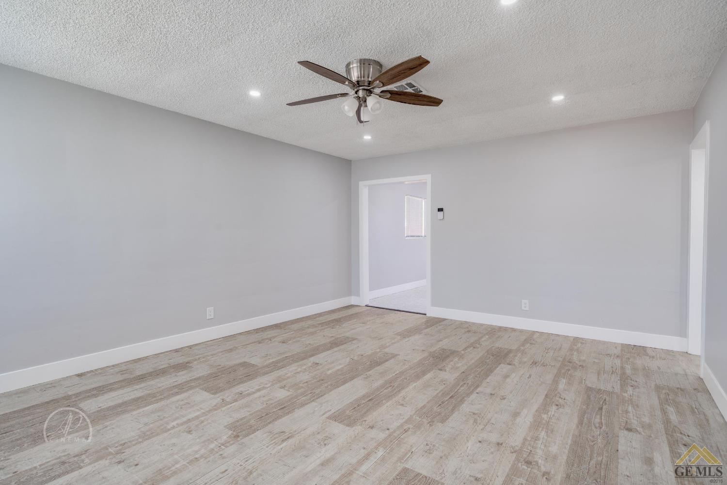Undisclosed Address Bakersfield, CA 93305 - Photo 2 of 28 wooden floor in an empty room