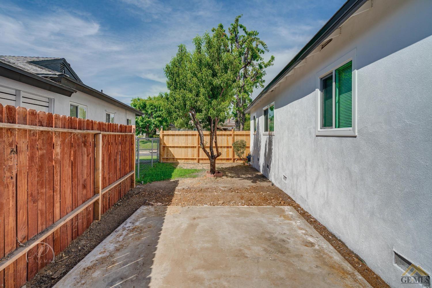 Undisclosed Address Bakersfield, CA 93305 - Photo 21 of 28 a view of a pathway of a house with wooden floor