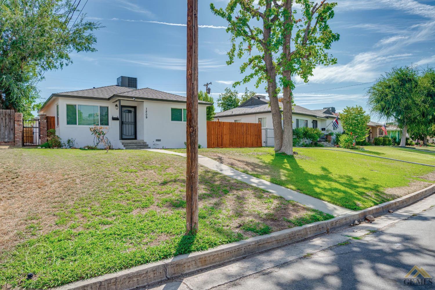 Undisclosed Address Bakersfield, CA 93305 - Photo 28 of 28 a front view of a house with garden