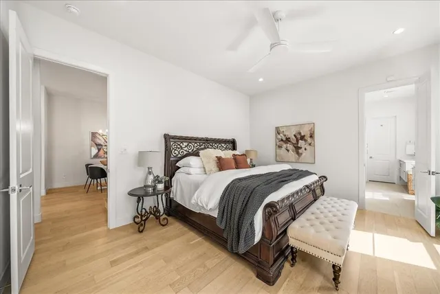 a bedroom with a bed and a table