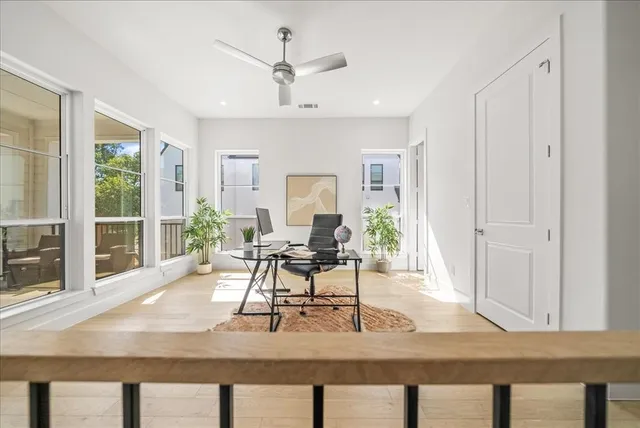 a view of a livingroom with furniture window and wooden floor