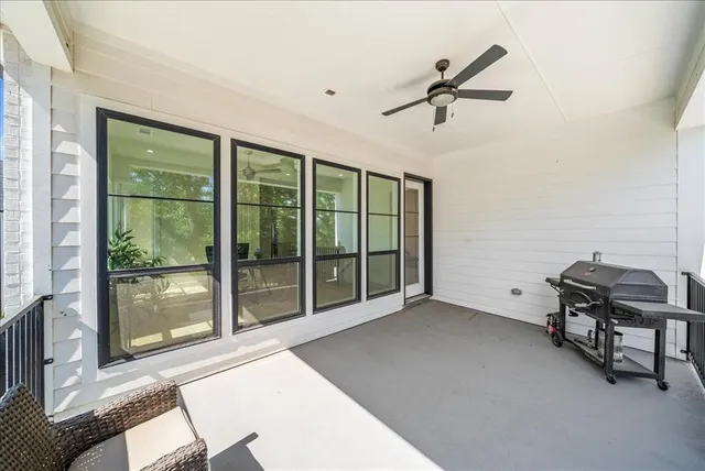 a view of a livingroom with furniture and windows