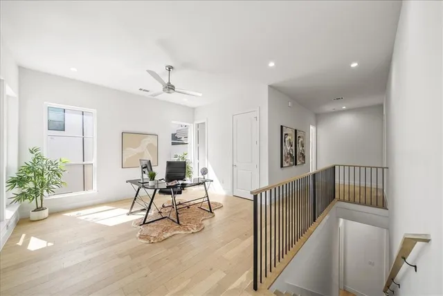a view of a livingroom with furniture and lounge chair