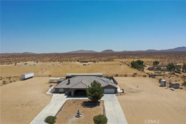 an aerial view of a house with a ocean view