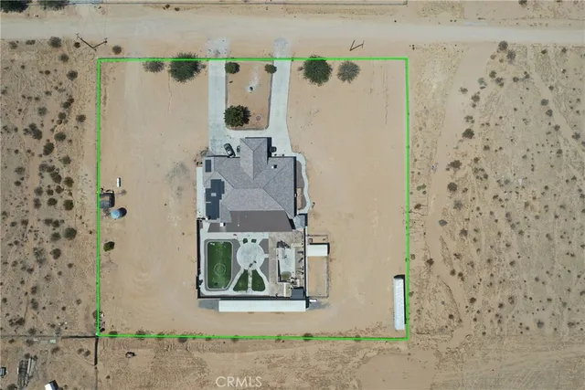 an aerial view of residential house with outdoor space